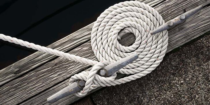 Three-strand dock line made fast to a cleat