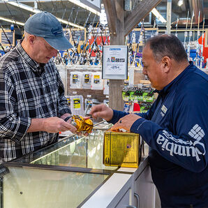 West Marine crew member helping a customer