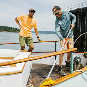 two people working on a boat