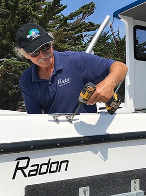 person installing a deck cleat