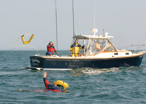 lifesling 2 rescue sling being thrown to an overboard crew member