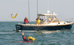 the lifesling2 being thrown to an overboard crew member