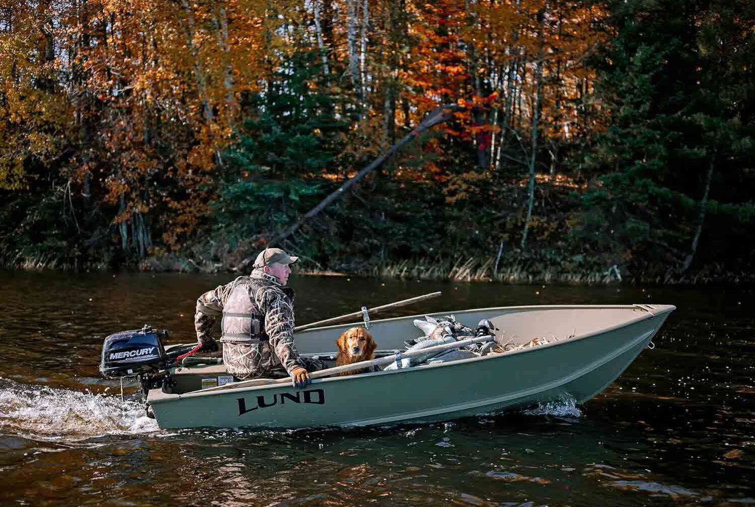 small fishing boat moving through the water with a small Mercury outboard attached