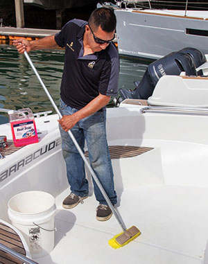 Man scrubbing cockpit deck.