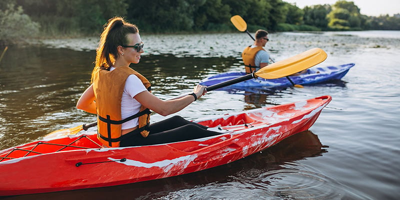 People paddling kayaks