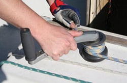 Lewmar OneTouch winch handle being removed from a winch