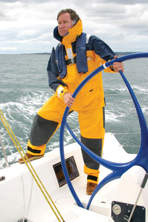 Chuck Hawley at the helm of a sailboat