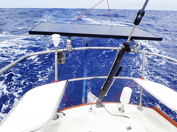 165-watt rigid monocrystalline solar panel mounted on a cal 40 sailboat