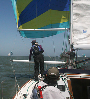 spinnaker pole and reaching strut in use on a cal 40 sailboat