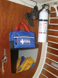 fire extinguisher, first aid kit and life jacket on a boat
