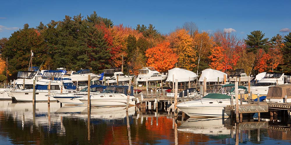 New England harbor with fall foliage in background