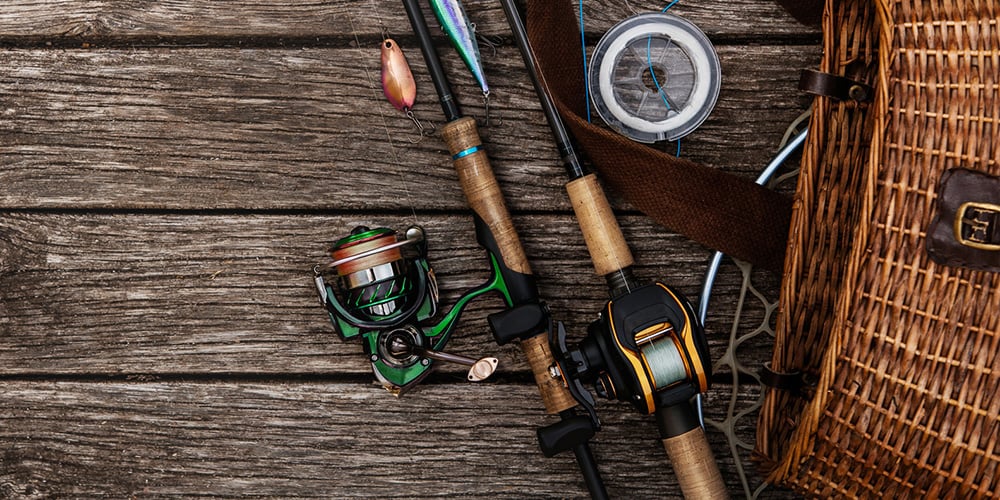 Spinning and baitcasting rod and reel setups next to creel