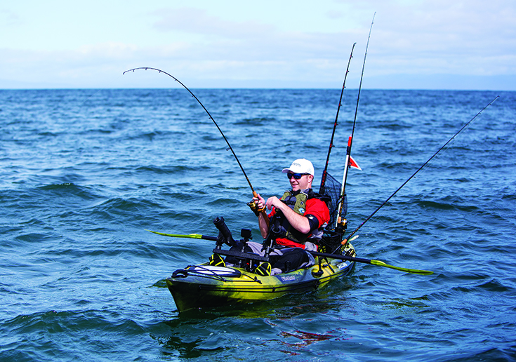 angler fishing from a pedal drive sit-on-top kayak