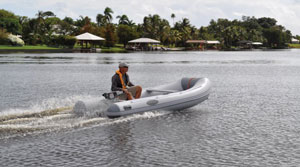 West Marine RIB 310 inflatable boat on a plane powered by Torqeedo Cruise 4.0 electric outboard