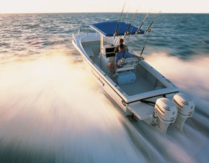 Dual outboard center console boat planing at high speed