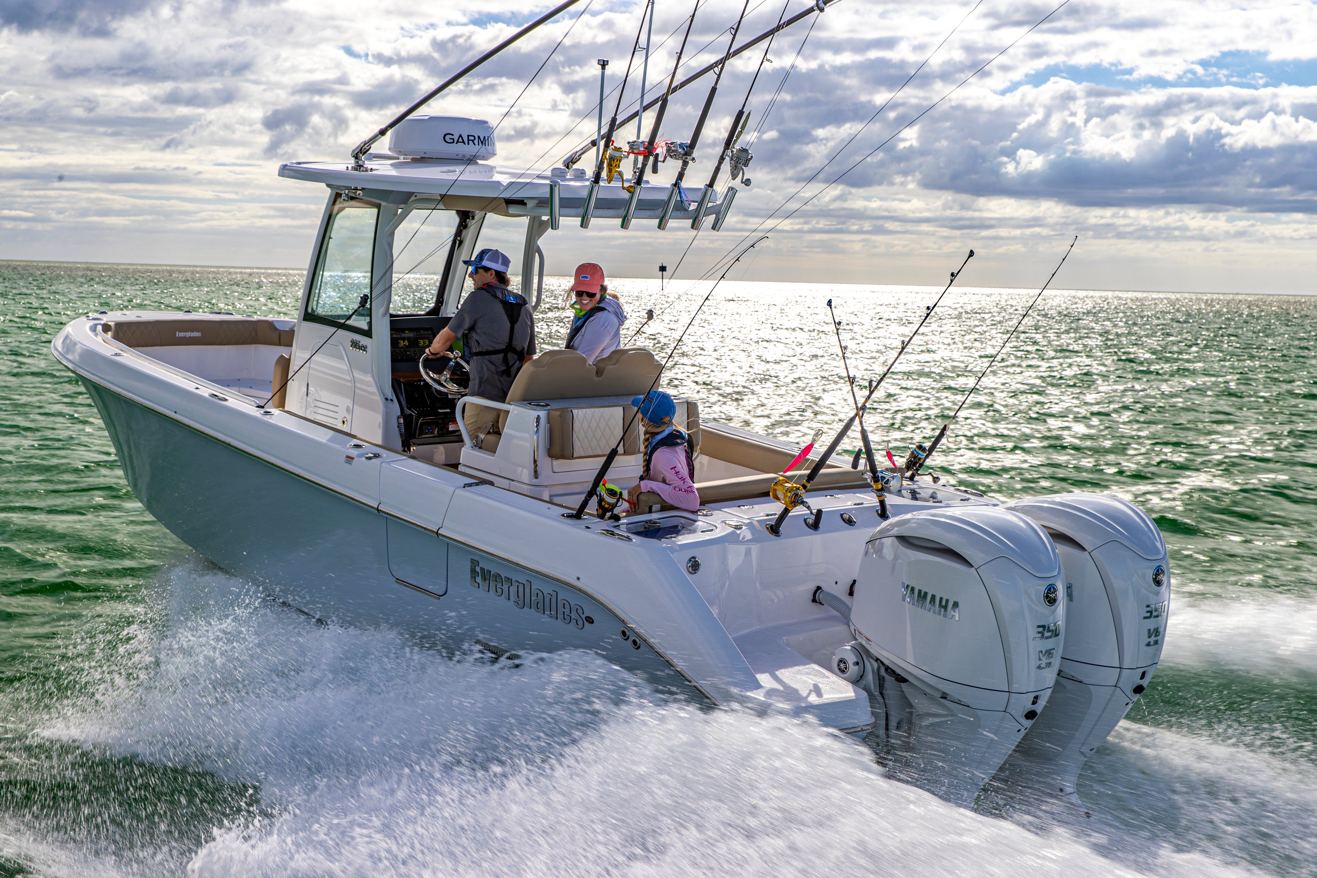 two 350 horsepower yamaha outboard motors attached to a center console fishing boat moving through the water