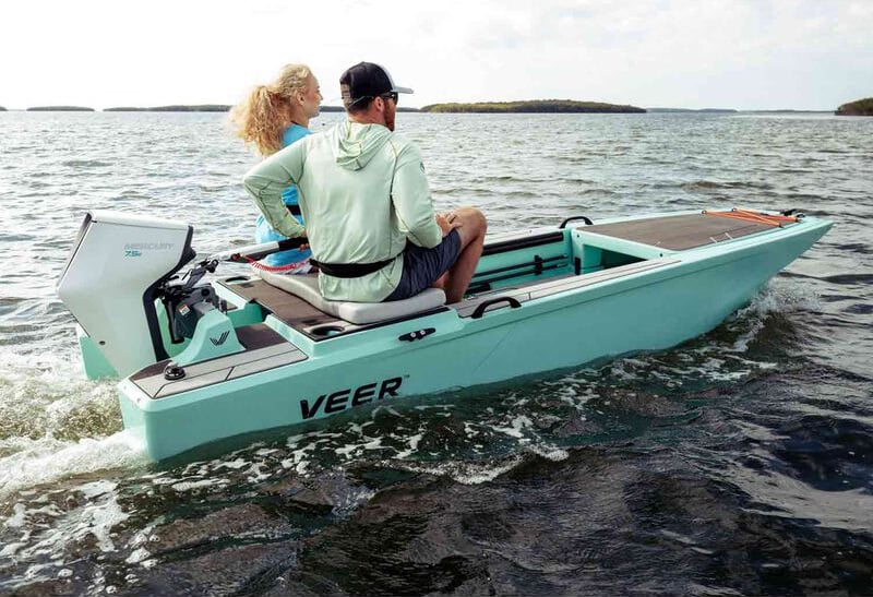 two people on a boat using an electric outboard