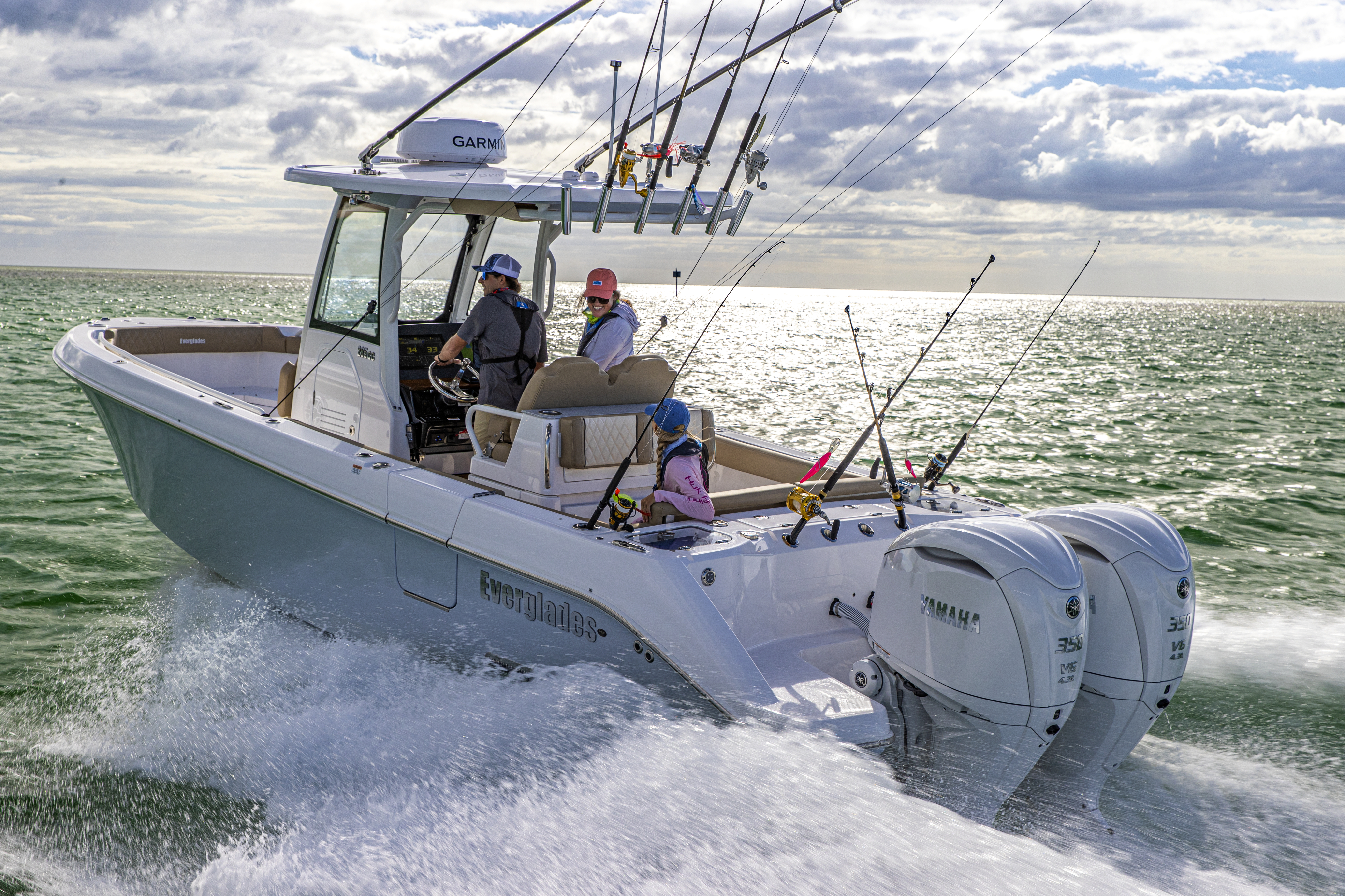 two 350 horsepower yamaha outboard motors attached to a center console fishing boat moving through the water