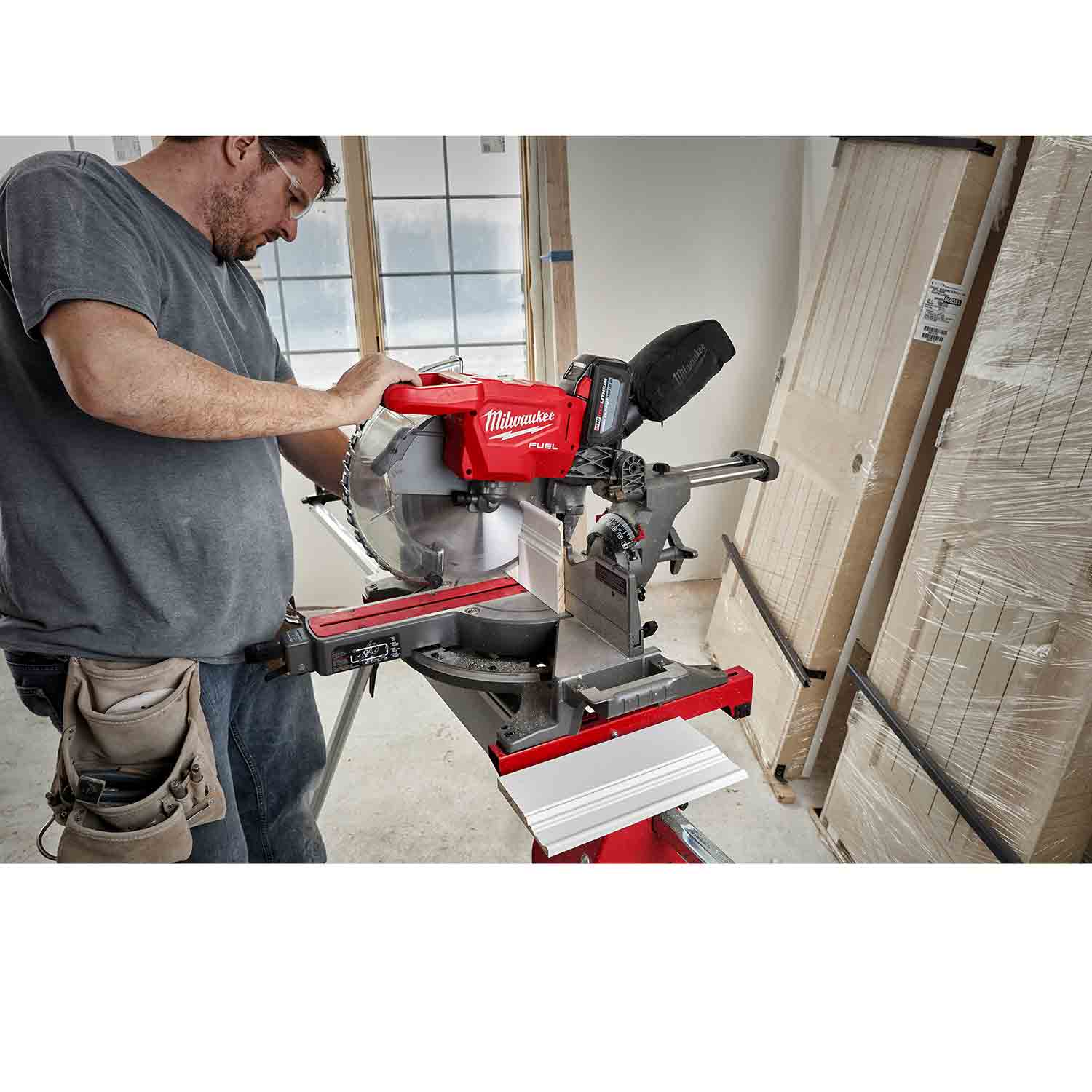 Milwaukee M18 FUEL 12 Dual Bevel Sliding Miter Saw hero shot, showcasing its robust design and cordless portability.
